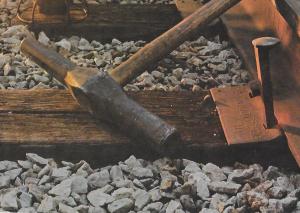 The "T" rail, the offset head cut spike, and the wood tie go back a long way. As does the spike maul.